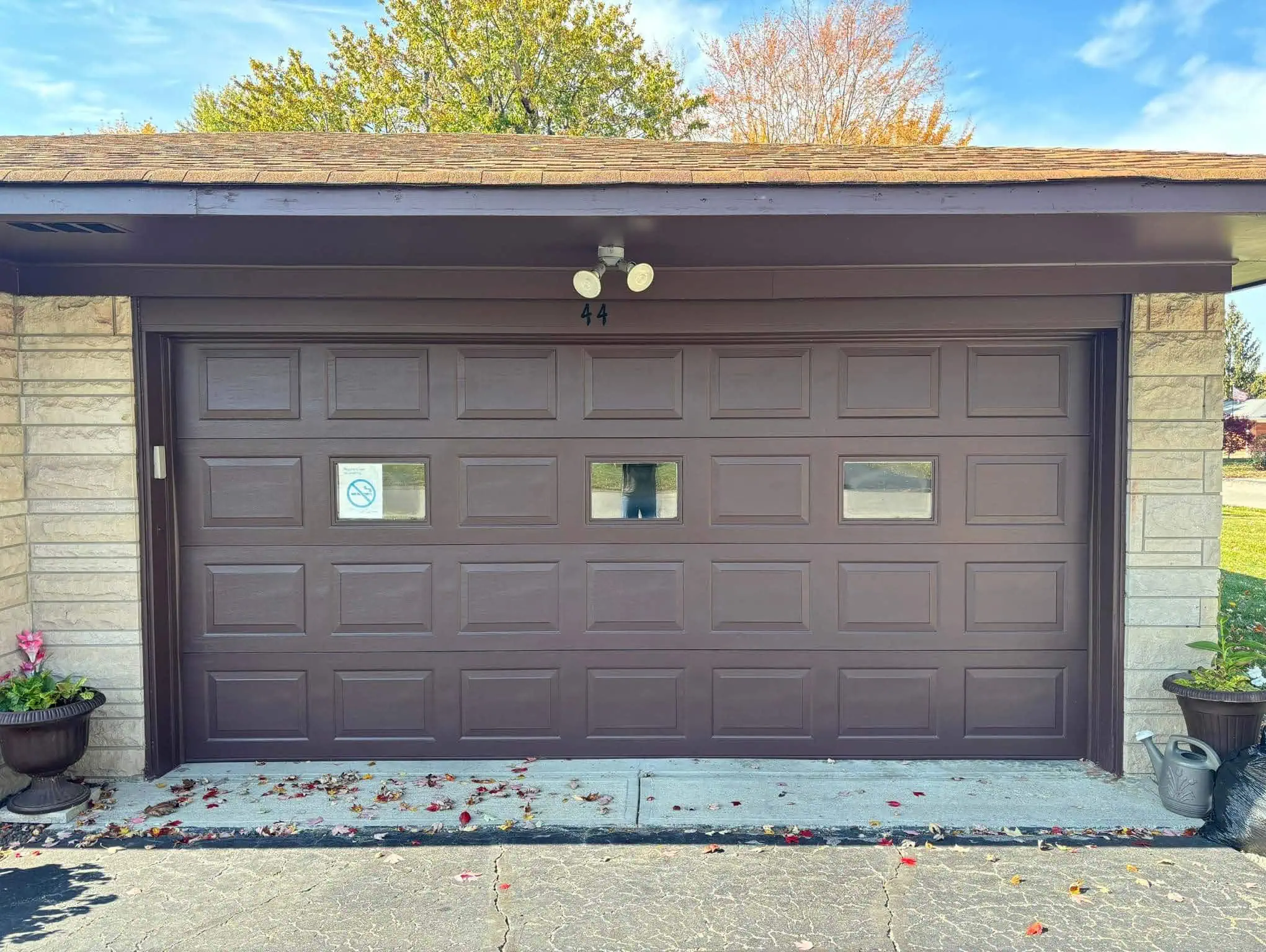 Garage doors painted with vibrant colors as part of exterior painting solutions.