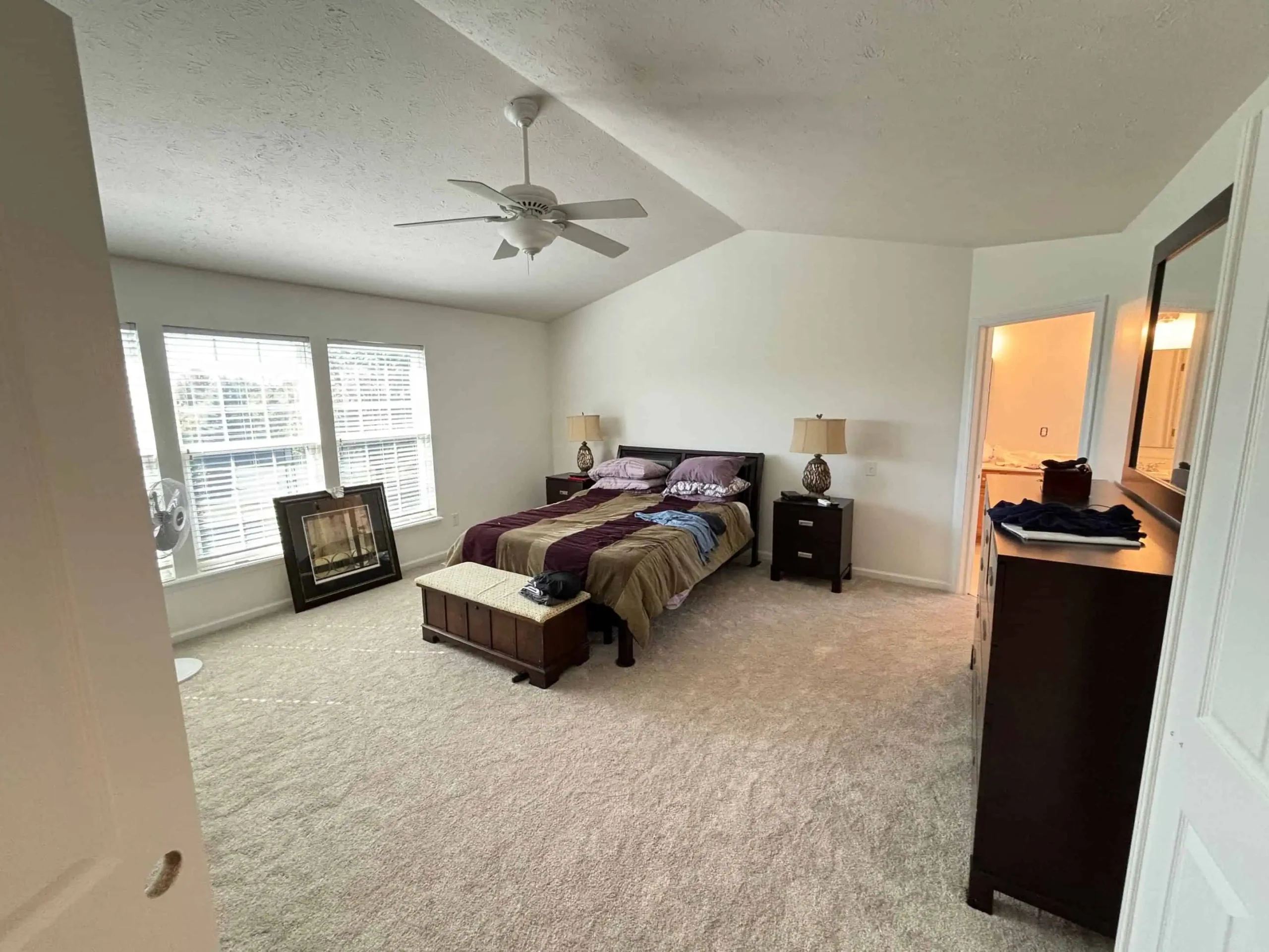 Spacious bedroom with freshly painted walls by expert interior painters in Indianapolis.