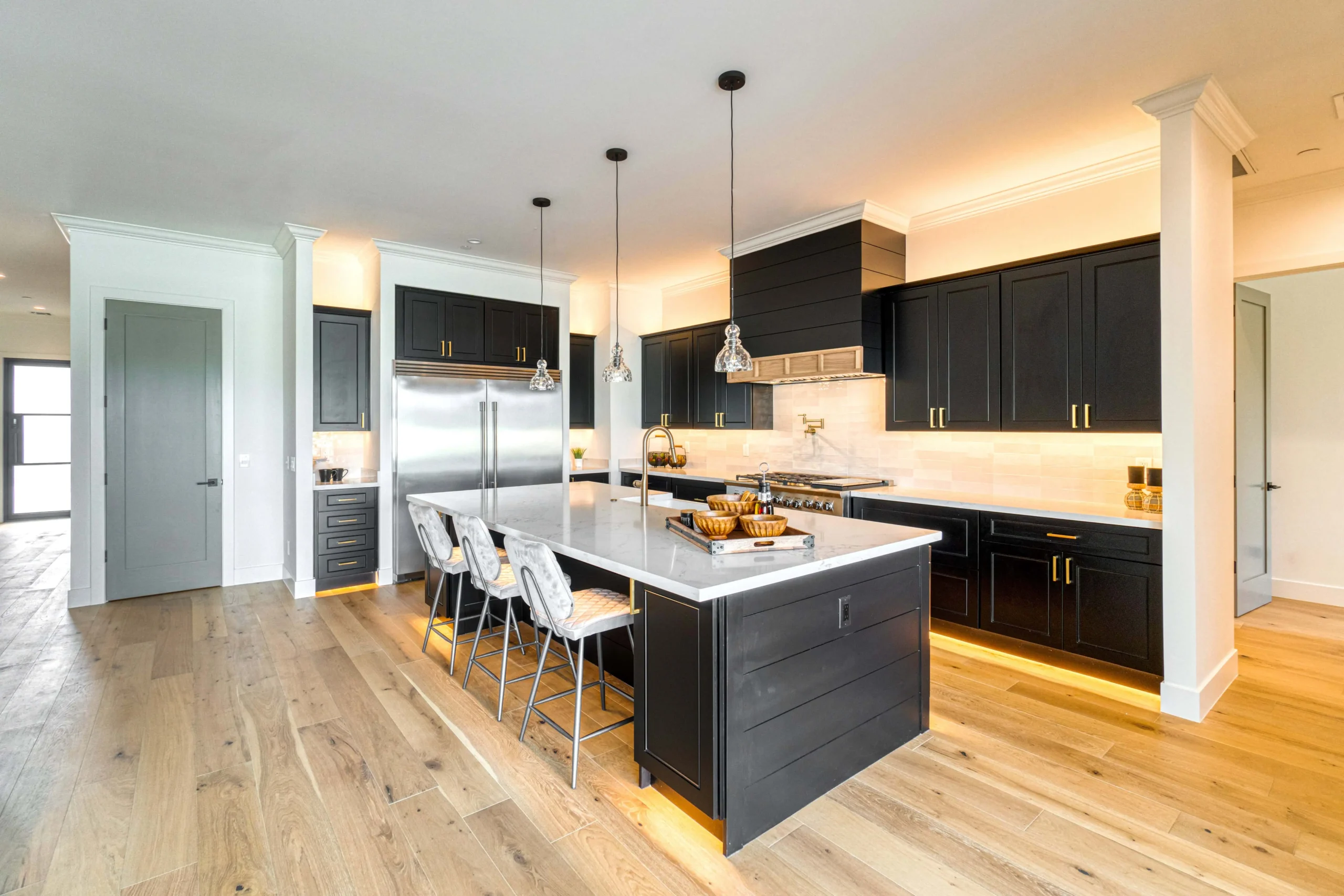 Modern kitchen with professionally painted cabinets, enhancing style and value.