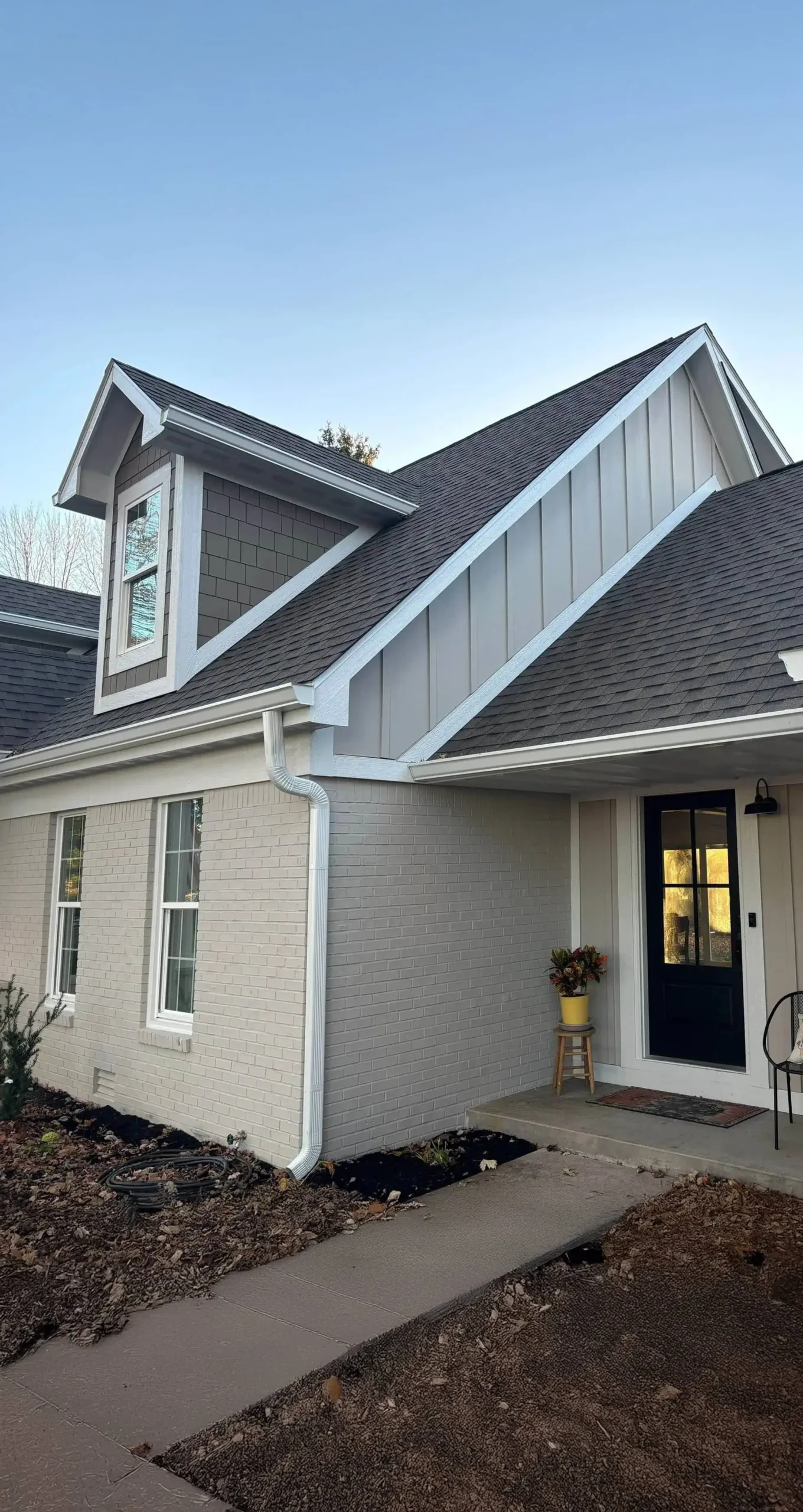 A freshly painted modern house exterior with a clean front porch, showcasing professional exterior painting services in Indianapolis.